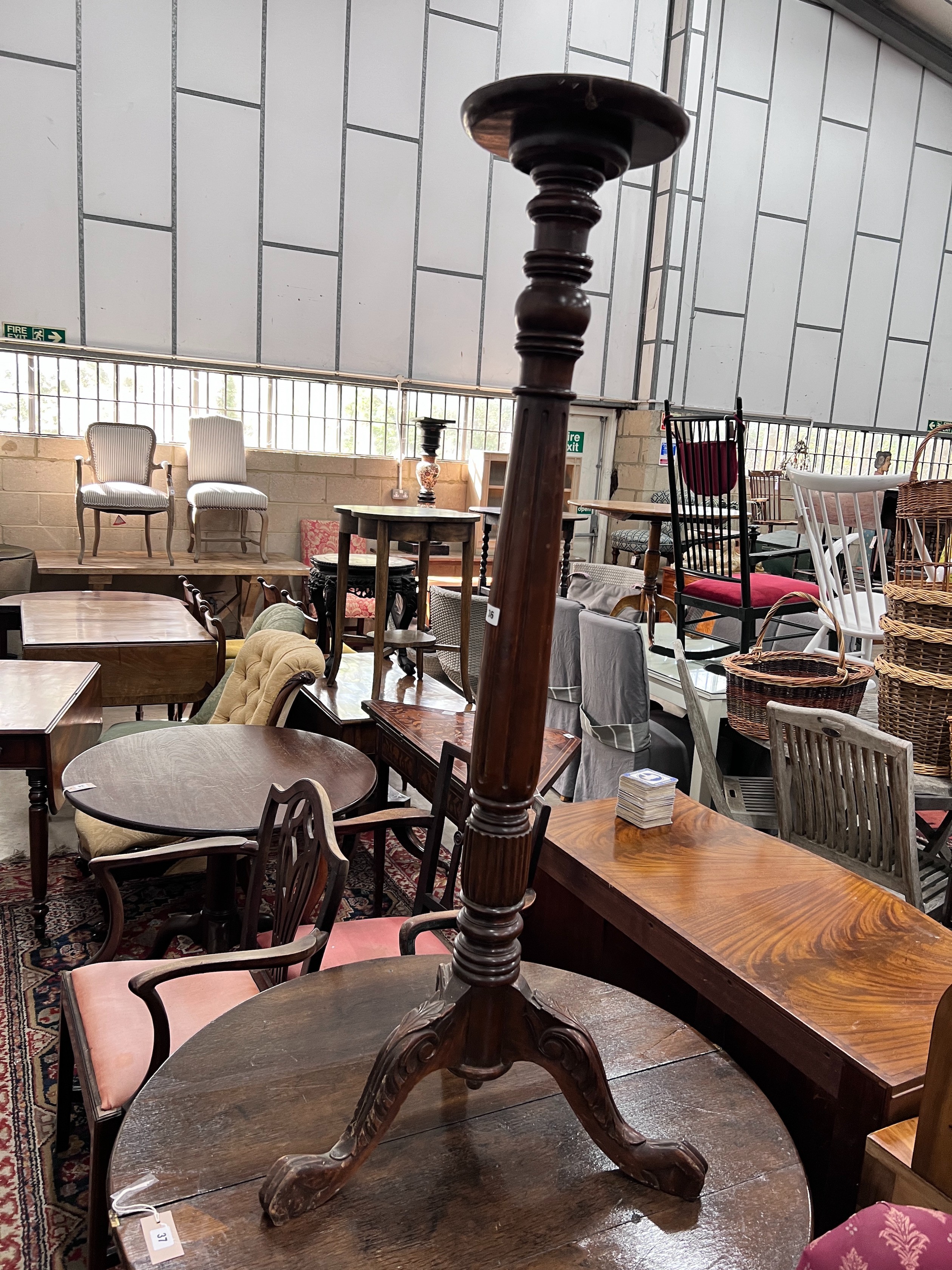 A George III style mahogany torchere, height 131cm *Please note the sale commences at 9am.